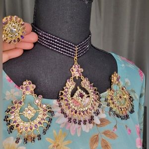 A beautiful purple set with earrings. Choker necklace and ring